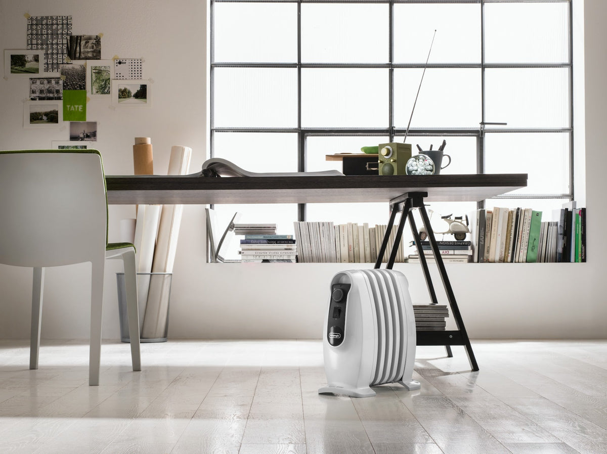 De'Longhi Nano 500W Oil-Filled Radiator - White - next to a desk in a home office