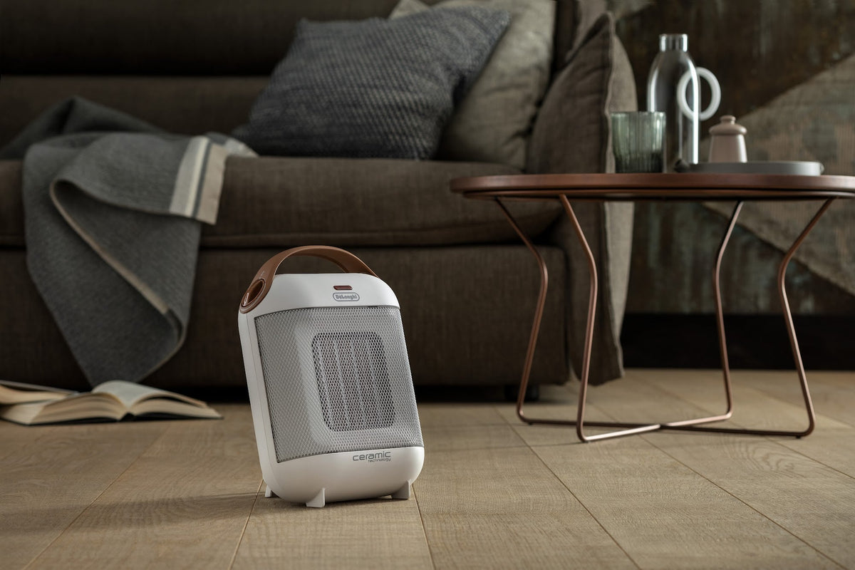De'Longhi Capsule 1800W Fan Heater - White - in a living room