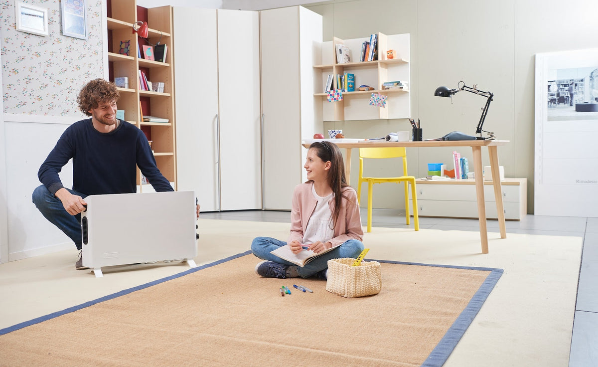 De'Longhi Slimline 2000W Convector Heater - White - in a family room