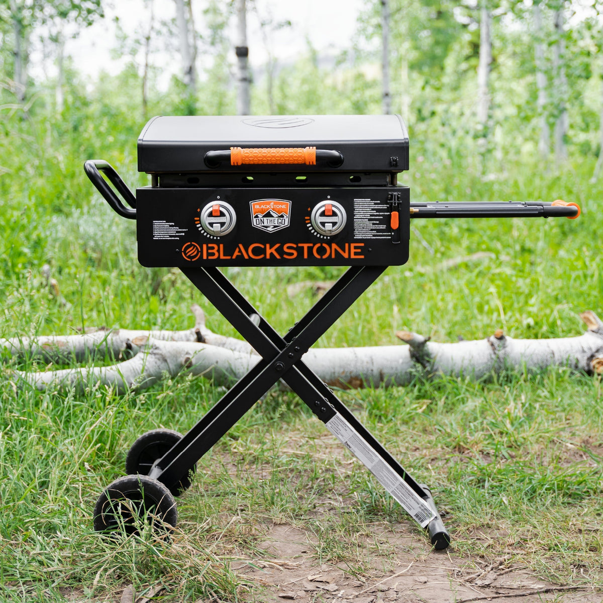 Blackstone On The Go 22" Omnivore Gas Griddle with Hood and Flexfold Legs - Black - set up outdoors