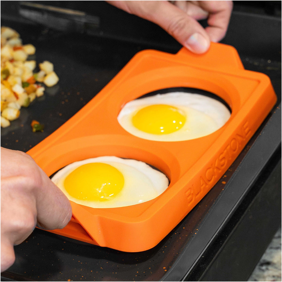 Blackstone 2 Section Silicone Egg Ring Trays, 3 Pack - Orange - fried eggs in the trays