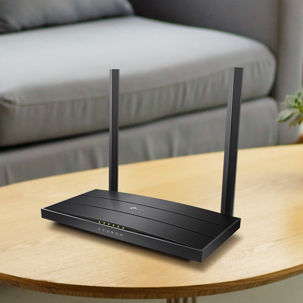 TP-Link Archer VR400, single unit on a wood side table — lifestyle