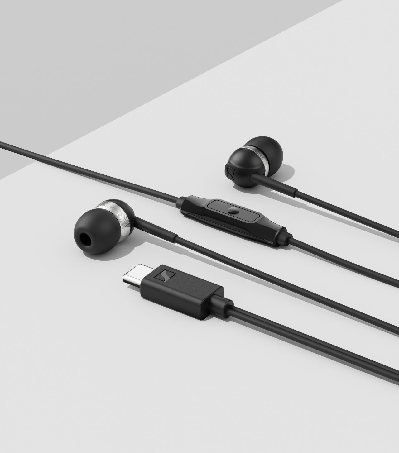 Sennheiser CX 80U USB-C Earphones Black — styled flatlay on two-tone background