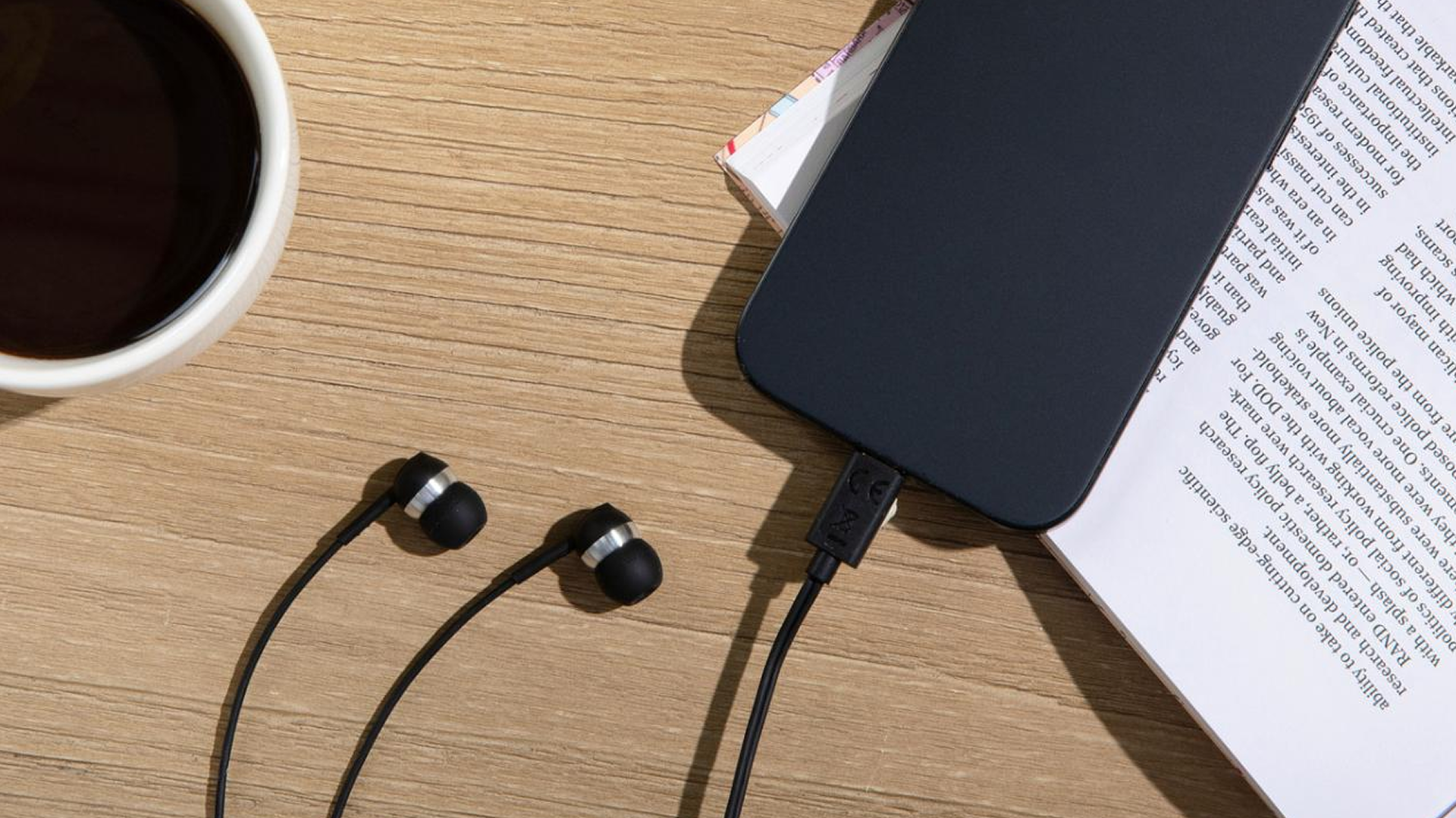 Sennheiser CX 80U USB-C Earphones Black — lifestyle flatlay with coffee, phone and book