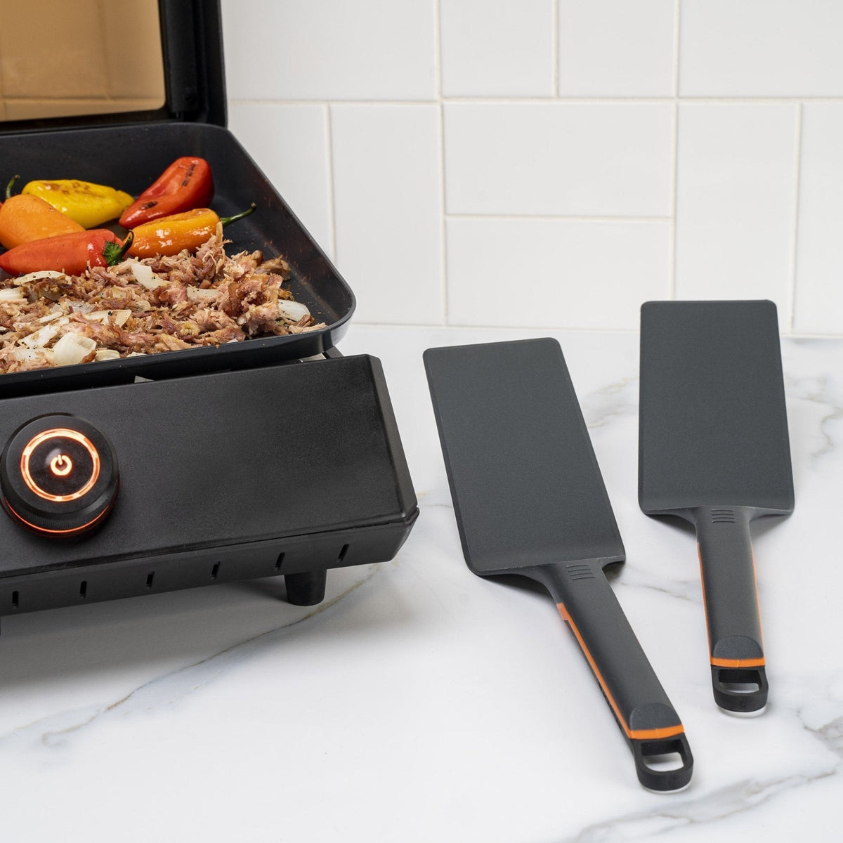 Blackstone E-Series 4 Piece Nylon Griddle Kit - spatulas beside the E-Series