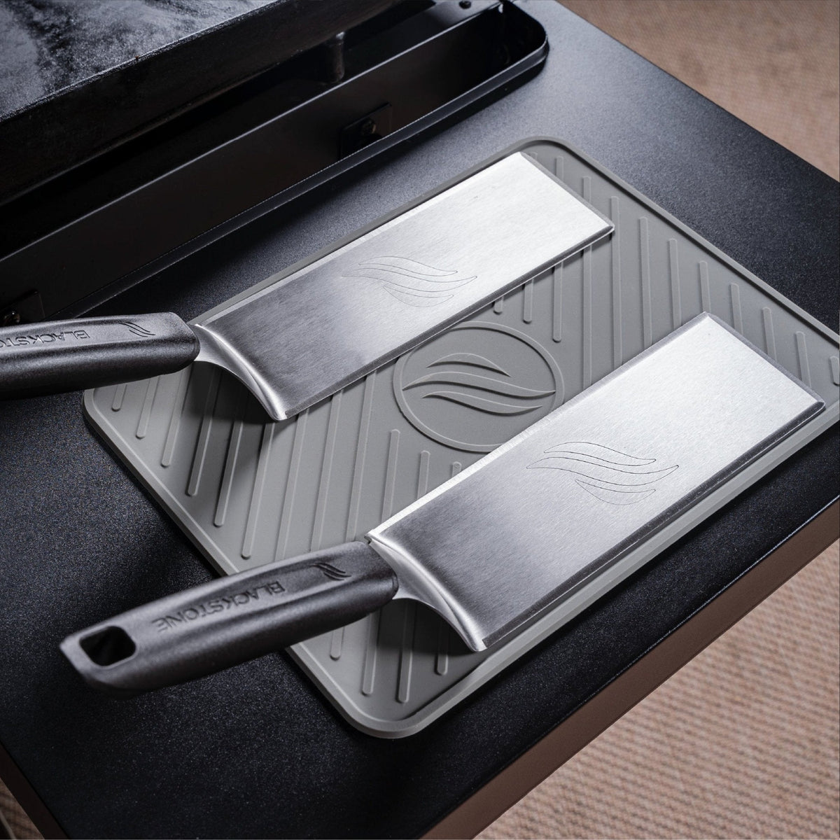 Blackstone Large Silicone Griddle Tool Mat - Grey - scrapers resting on the mat