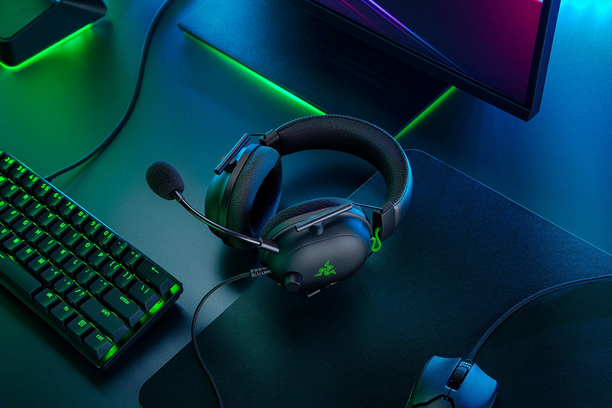 Razer BlackShark V2 Wired Esports Headset with USB Sound Card - Black - on a gaming desk