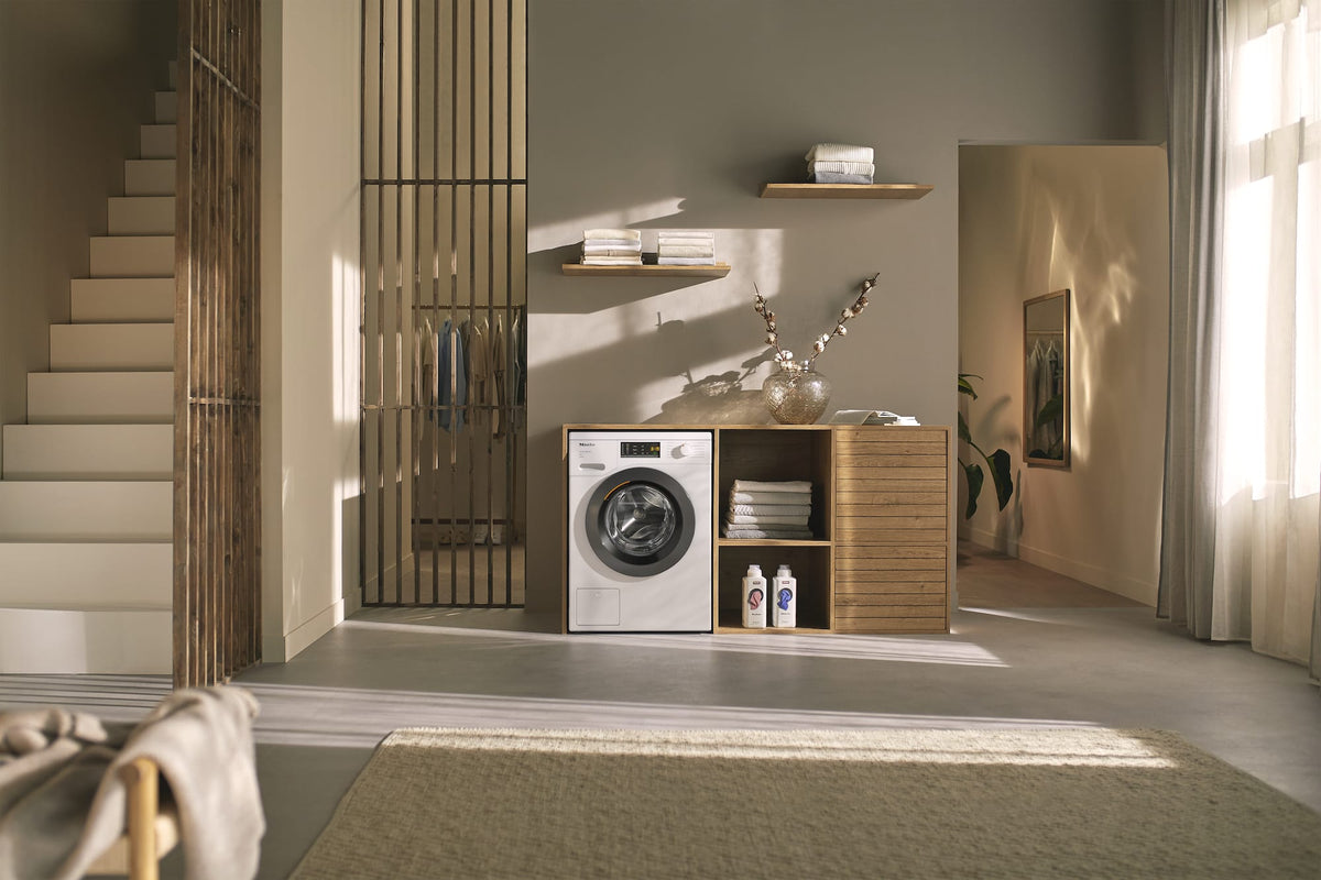 Miele W1 Active WEA125 WCS 8kg 1400rpm Washing Machine - Lotus White - in a utility room