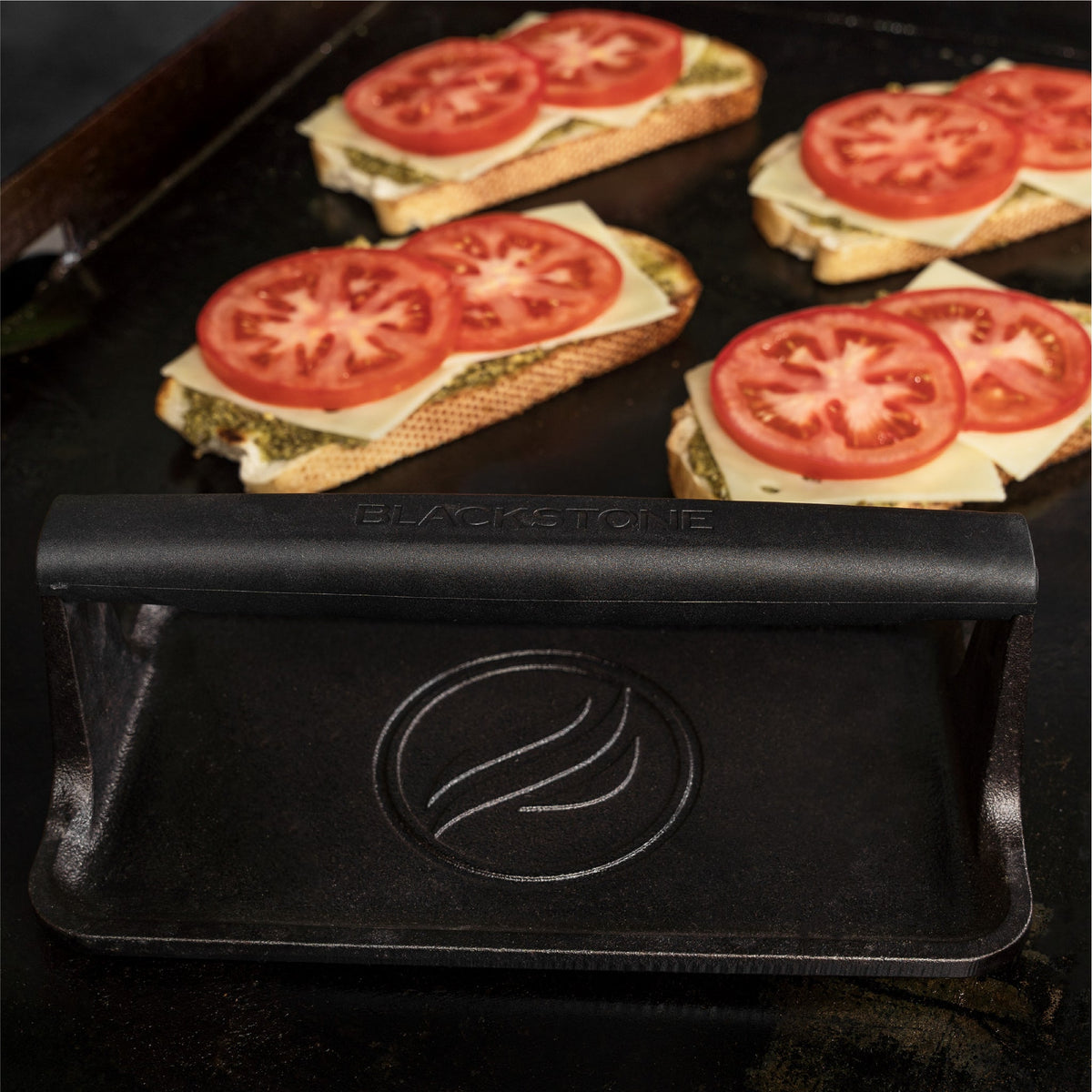 Blackstone Medium Cast Iron Griddle Press - press on the griddle