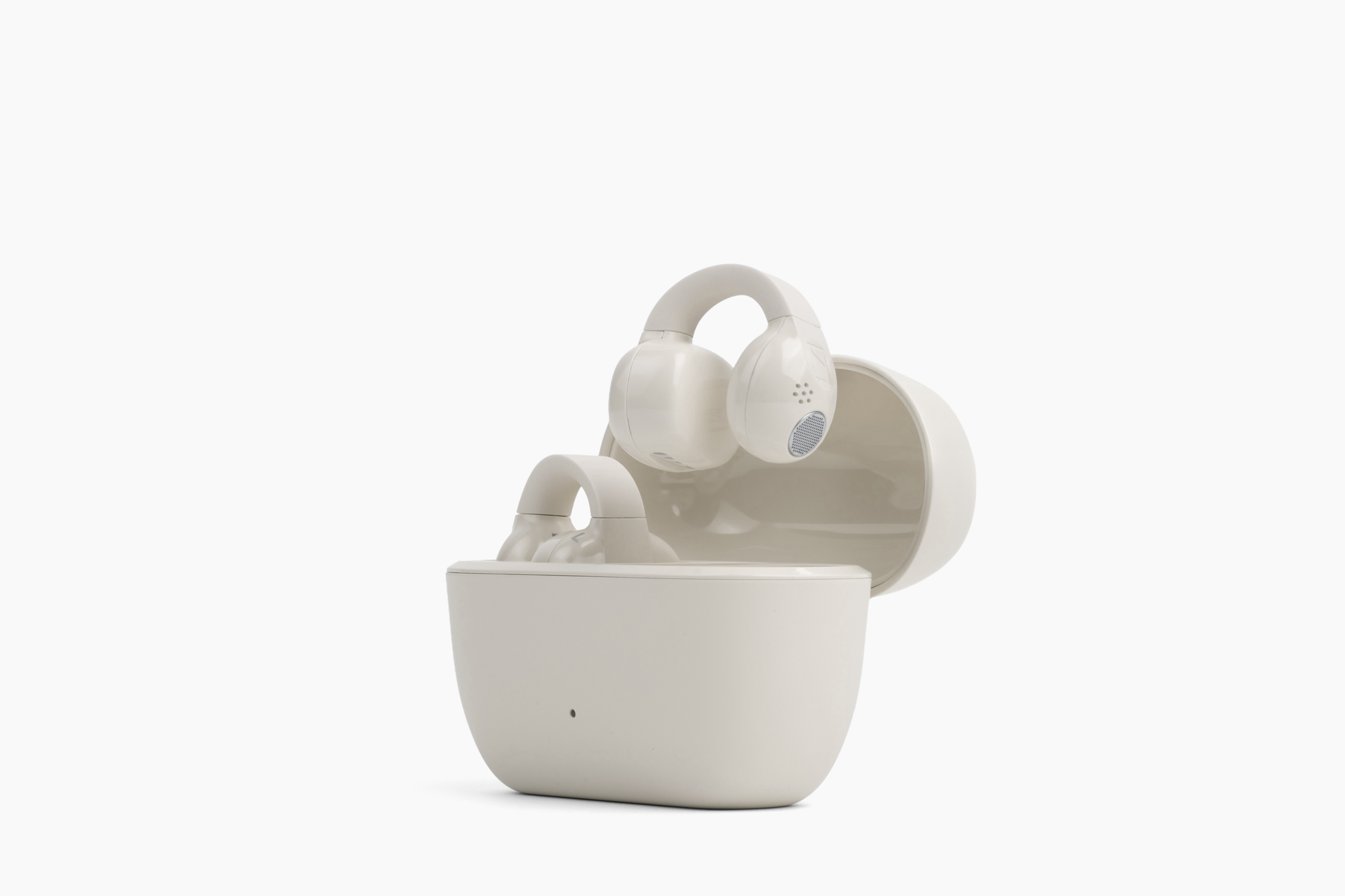 Sennheiser ACCENTUM Clip Open-Ear Earphones Cream — case standing with earbuds, front hero shot