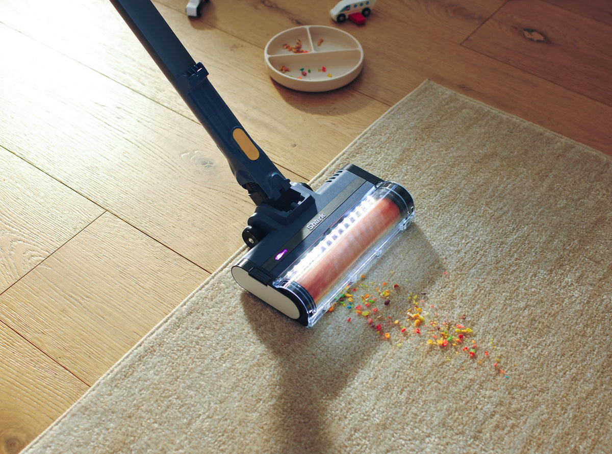 Shark Cordless Stick Vacuum with Anti Hair Wrap - Blue - cleaning a rug