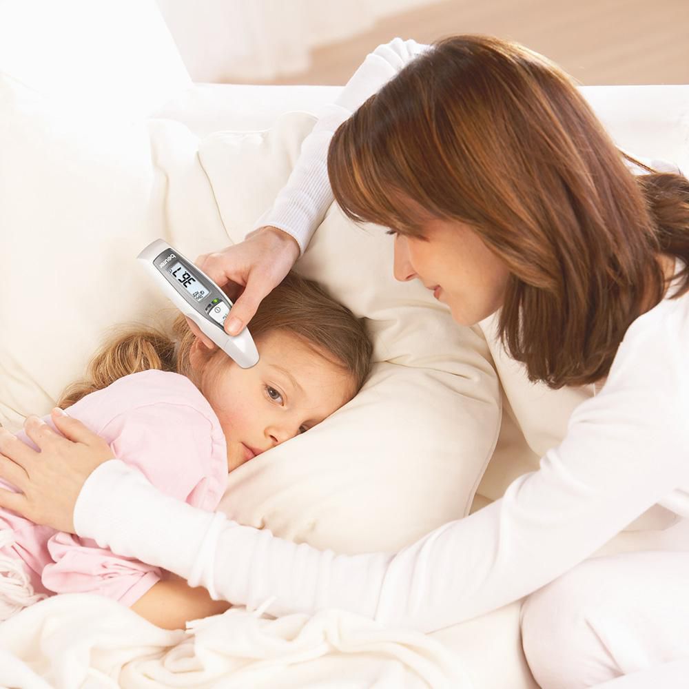 Beurer FT 65 multifunction thermometer — lifestyle view, forehead temperature measurement