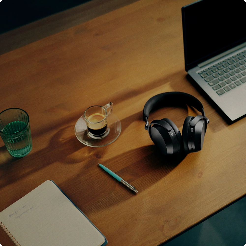 Sennheiser MOMENTUM 5 Wireless Headphones Black — lifestyle desk scene